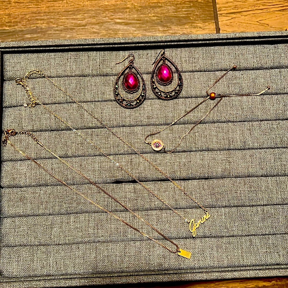 Two gold necklaces, bracelet, and fashion earrings.